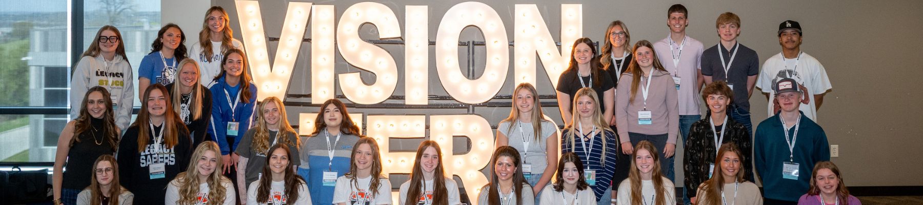 Group of Vision Zero Students posing next to the Vision Zero Sign