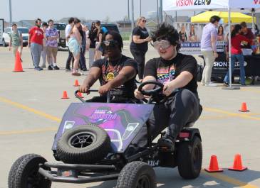 Young students driving a go-cart at a Vision Zero Event