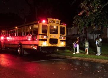 School bus stopped with students entering the bus