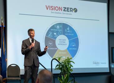 Speaker Presenting a Pie Chart at the Vision Zero Partner Conference