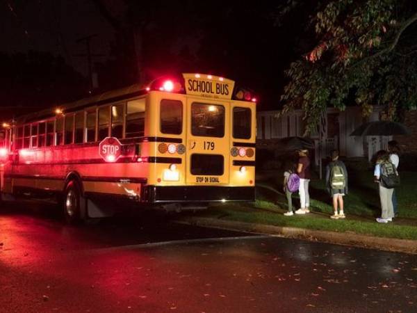 School bus stopped with students entering the bus