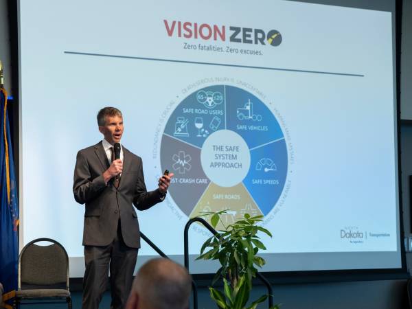 Speaker Presenting a Pie Chart at the Vision Zero Partner Conference