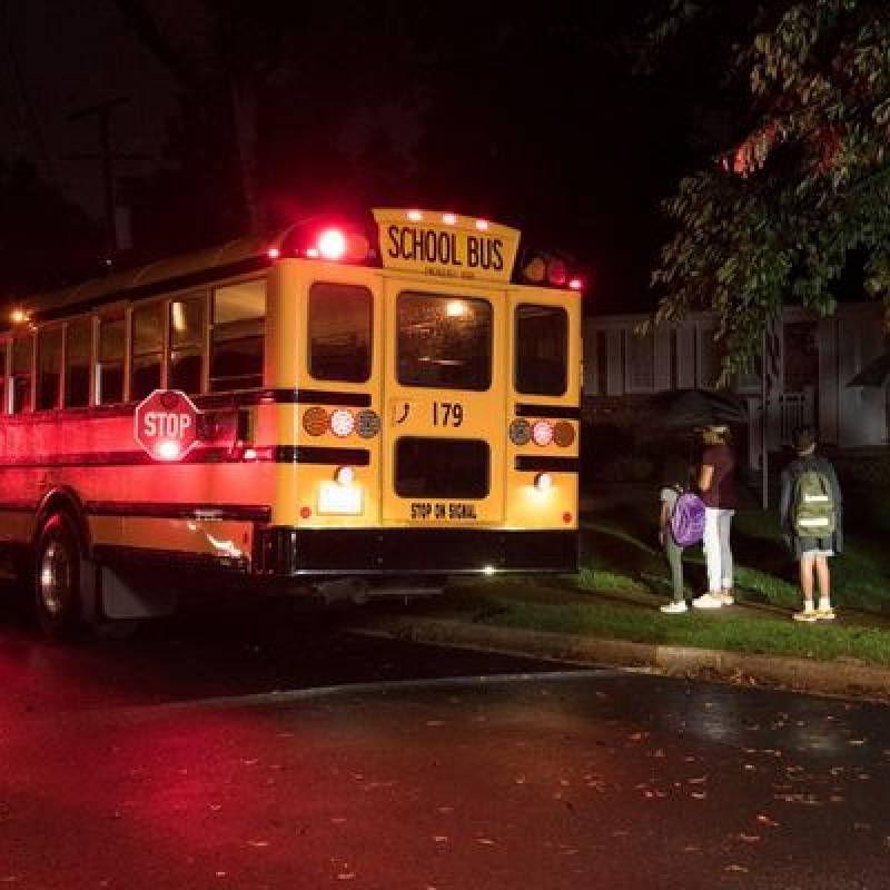 School bus stopped with students entering the bus