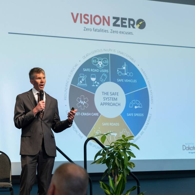 Speaker Presenting a Pie Chart at the Vision Zero Partner Conference